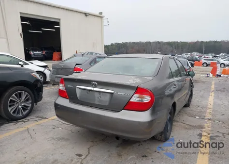 2002 Toyota Camry Le z USA, uszkodzony, nr VIN 4T1BE32K12U536831